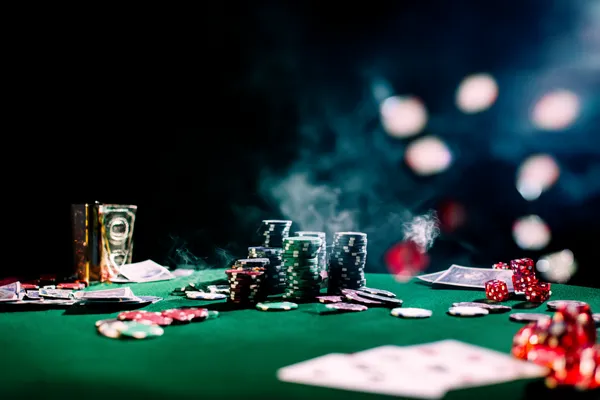 A close-up shot of golden coins falling around a spinning roulette wheel, representing immersive casino action at BLITZ.