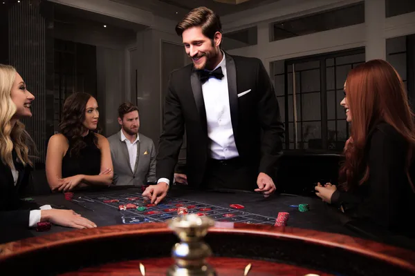 BLITZ Member Login — Return to your personalized dashboard A person using their device against a moody casino-themed background, illustrating the smooth re-entry process at BLITZ.